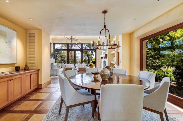dining area featuring an inviting chandelier, recessed lighting, and baseboards