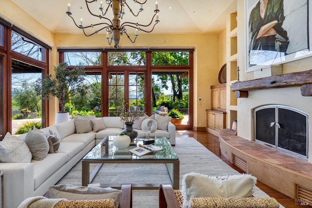 sunroom / solarium with a chandelier and plenty of natural light