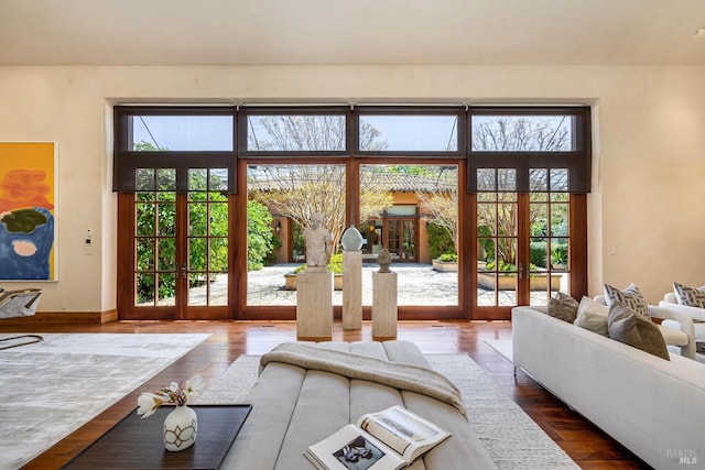entryway featuring french doors, wood-type flooring, and baseboards