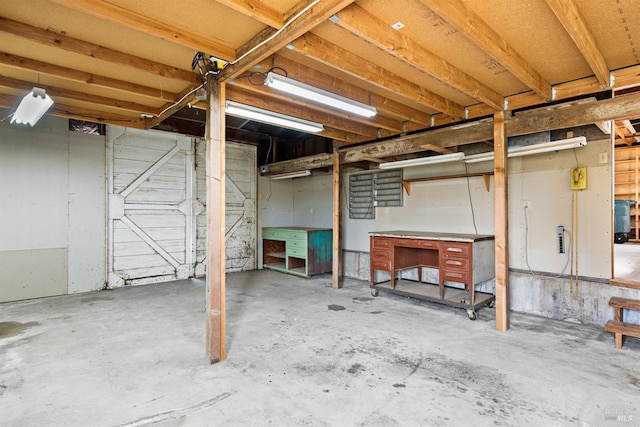 unfinished below grade area with a workshop area