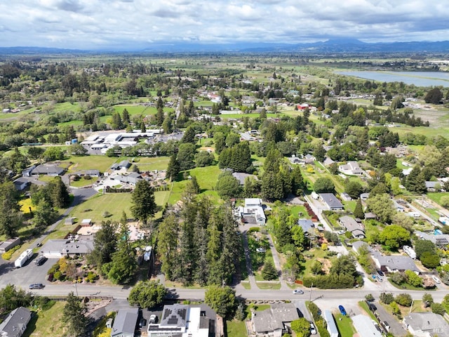 drone / aerial view featuring a water view and a residential view