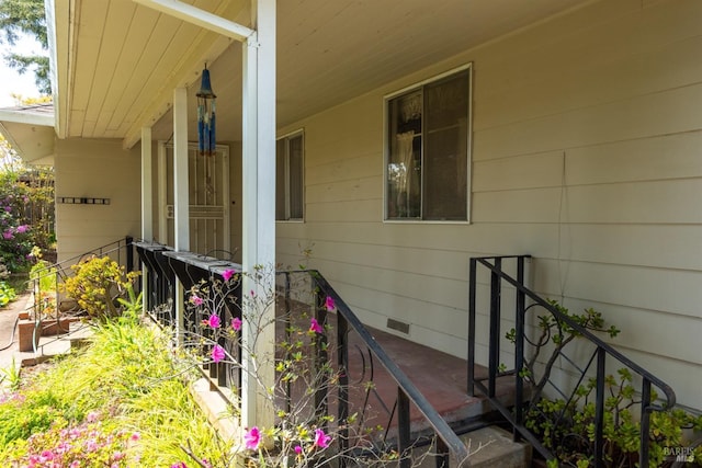 view of side of home featuring a porch
