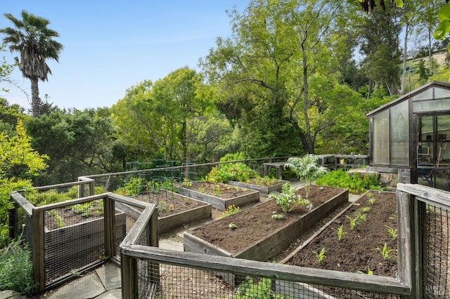 view of yard with an exterior structure and a vegetable garden