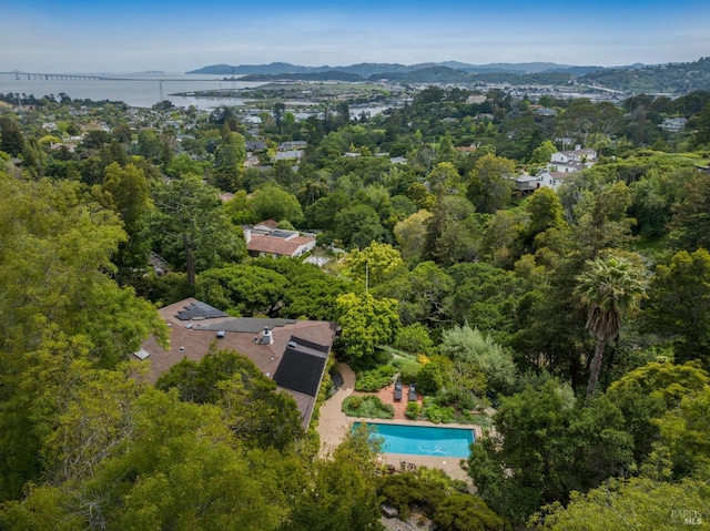 bird's eye view with a water and mountain view
