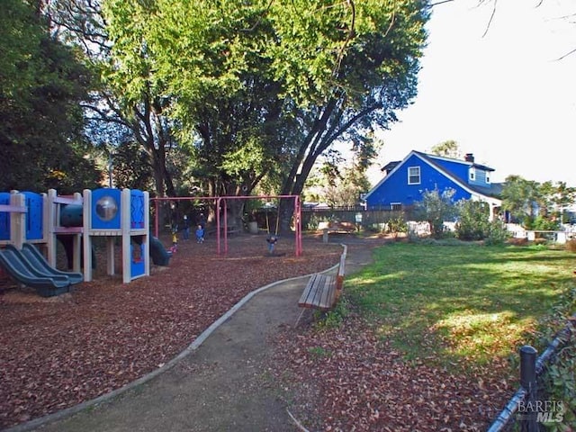 view of yard with fence and playground community