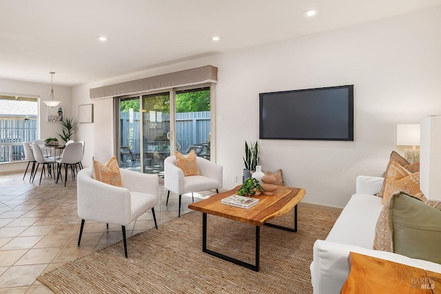 living room featuring light tile patterned floors, recessed lighting, and a wealth of natural light