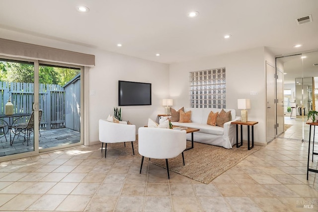 living area with visible vents, recessed lighting, and light tile patterned floors