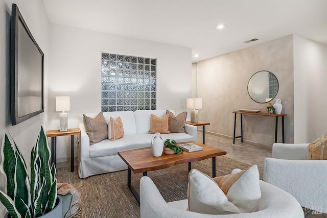 living room featuring recessed lighting, baseboards, and visible vents