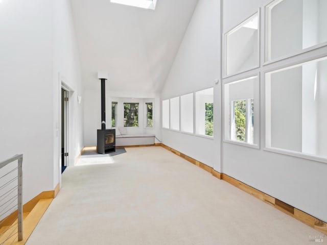 unfurnished sunroom with a wood stove
