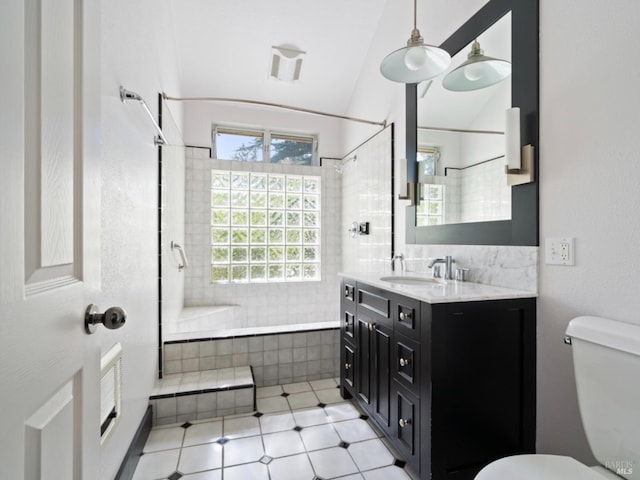 bathroom with vanity, tile patterned flooring, toilet, and lofted ceiling