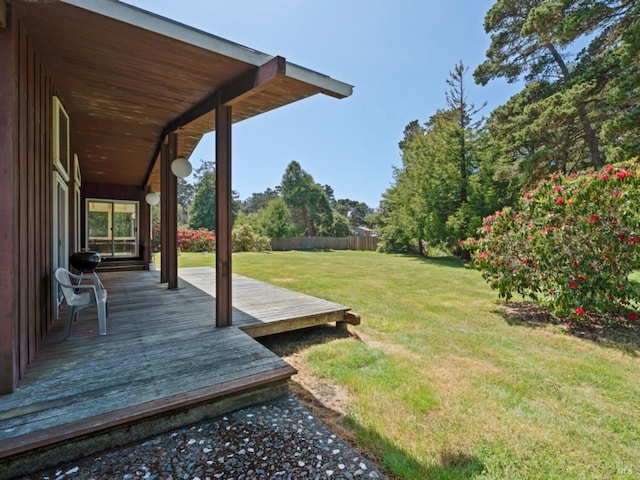 view of yard with fence and a wooden deck