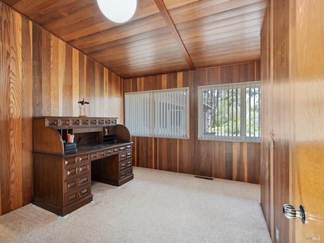 carpeted home office featuring wood walls, wood ceiling, and visible vents