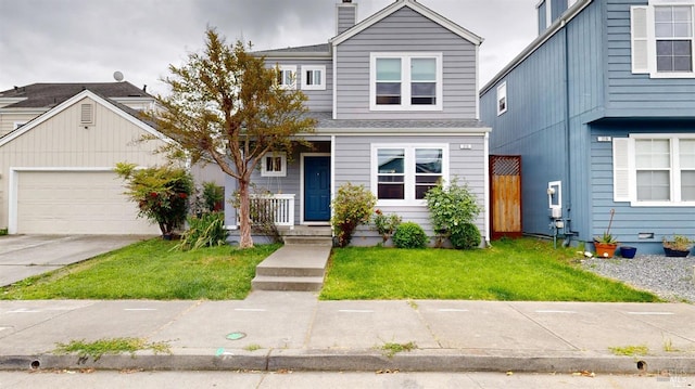 traditional-style house with concrete driveway, an attached garage, a chimney, and a front lawn
