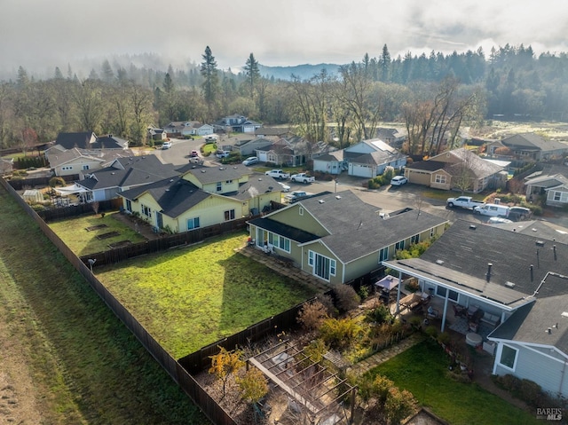 birds eye view of property featuring a residential view and a view of trees