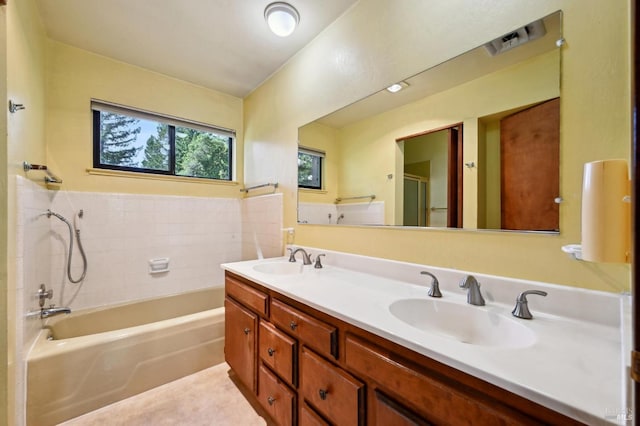 full bath with double vanity, an enclosed shower, a bathing tub, and a sink