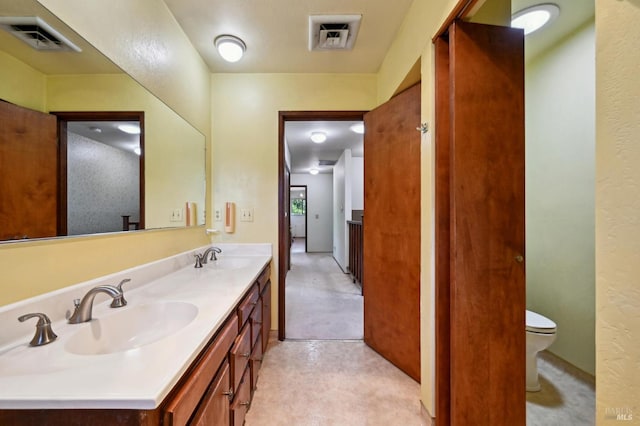 full bath with visible vents, a sink, and double vanity
