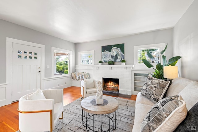 2855 Old Gravenstein Hwy, Sebastopol, CA 95472 - living area featuring wood finished floors, plenty of natural light, and a fireplace
