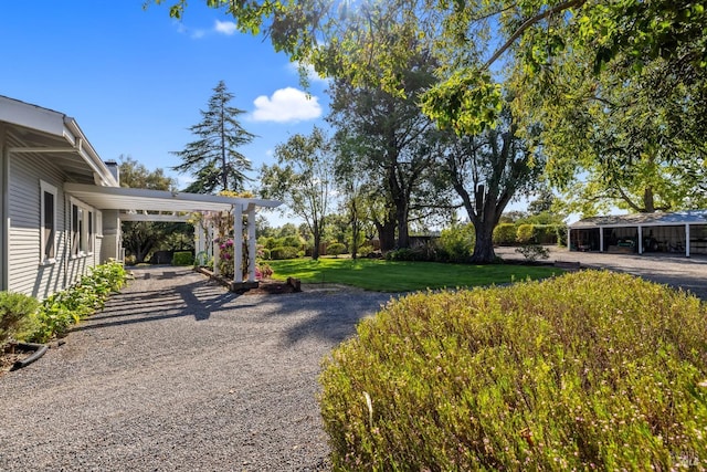 2855 Old Gravenstein Hwy, Sebastopol, CA 95472 - view of grassy yard with gravel driveway and a carport