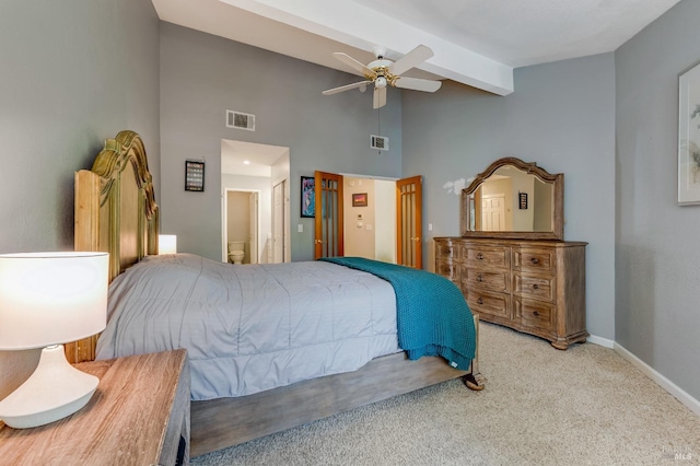 bedroom featuring carpet flooring, beamed ceiling, visible vents, and baseboards