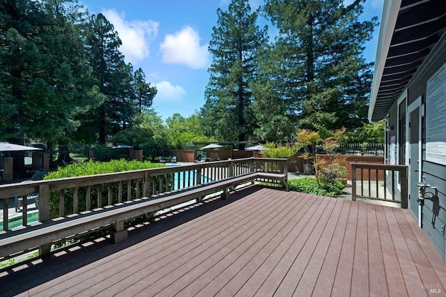 deck featuring a fenced backyard