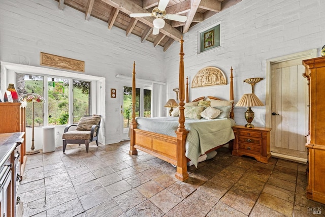 bedroom featuring high vaulted ceiling, wooden ceiling, beam ceiling, and stone tile flooring
