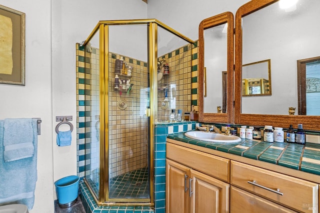 bathroom with vanity, a stall shower, and tile patterned floors