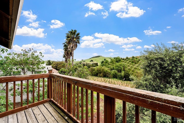 wooden terrace featuring a mountain view