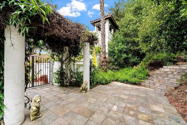 view of patio / terrace with a gate and stairway