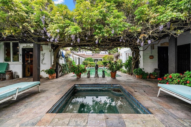 outdoor pool featuring a patio area