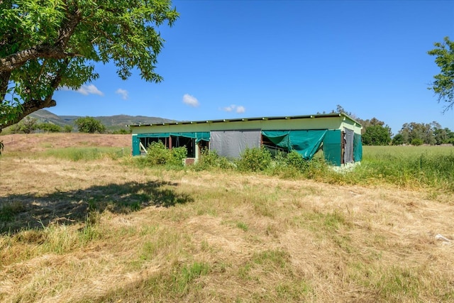 exterior space with a rural view