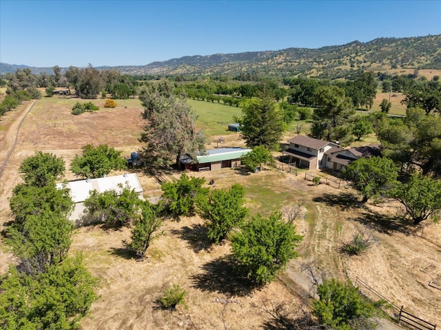 birds eye view of property with a mountain view and a rural view