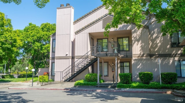 view of property featuring stairs