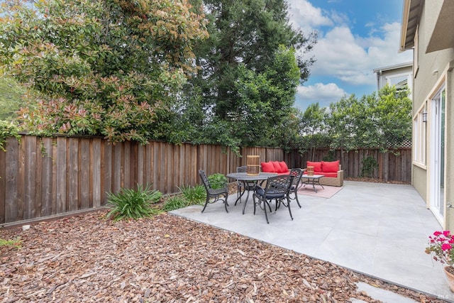 view of patio / terrace with a fenced backyard and an outdoor living space