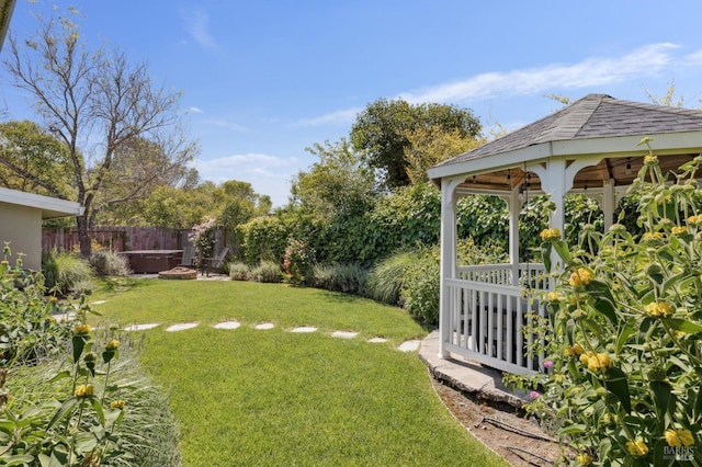 view of yard featuring a gazebo and fence