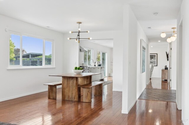 9 Monroe Ct, Novato, CA 94947 - interior space featuring baseboards, dark wood-type flooring, and a chandelier
