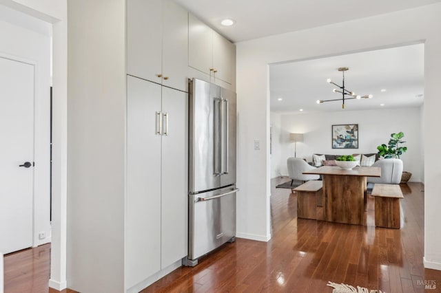 9 Monroe Ct, Novato, CA 94947 - kitchen featuring hardwood / wood-style floors, recessed lighting, white cabinetry, high end refrigerator, and a notable chandelier