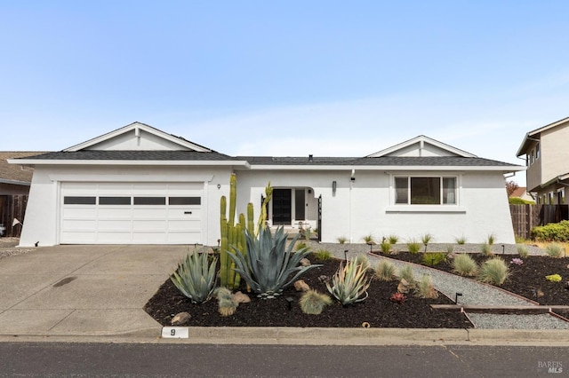 9 Monroe Ct, Novato, CA 94947 - single story home with a garage, stucco siding, concrete driveway, and roof with shingles