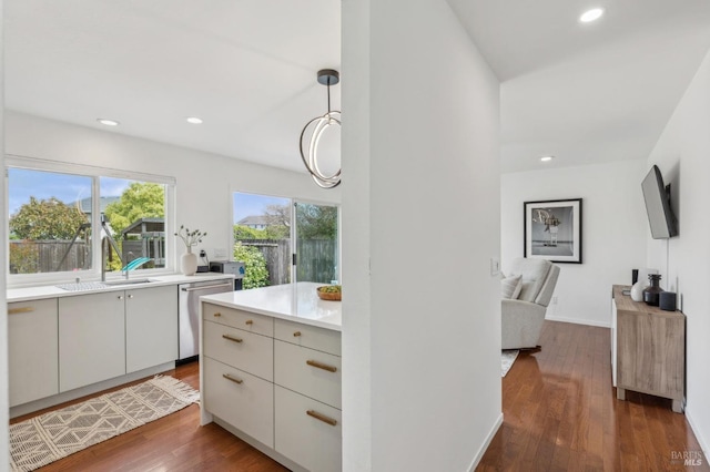 9 Monroe Ct, Novato, CA 94947 - kitchen with a sink, light countertops, dark wood finished floors, recessed lighting, and stainless steel dishwasher