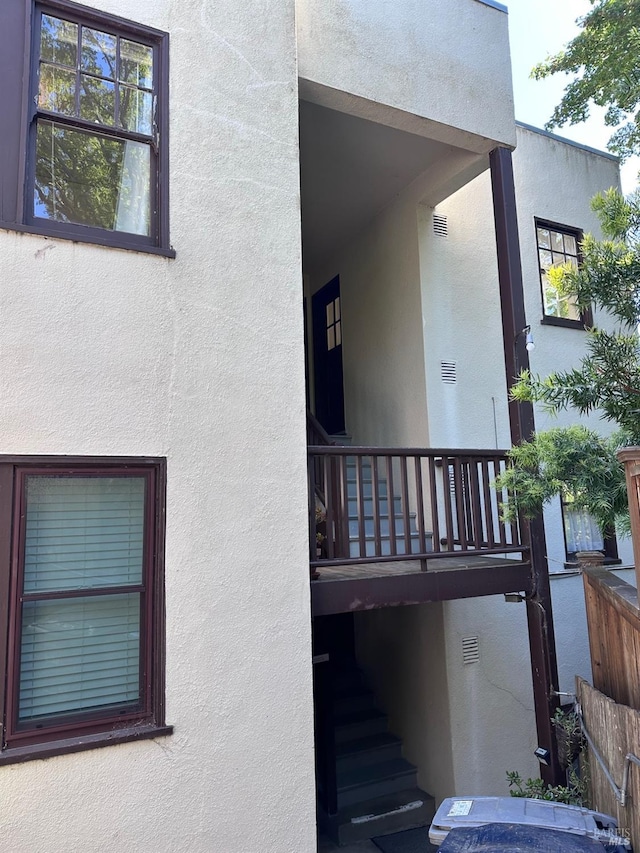 view of side of home with stucco siding