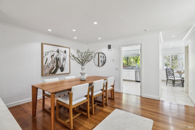 dining room featuring recessed lighting, visible vents, ornamental molding, and wood finished floors