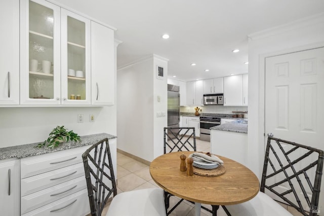 dining area featuring recessed lighting, baseboards, visible vents, and light tile patterned floors
