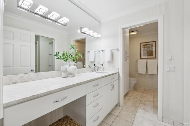 full bathroom featuring vanity, baseboards, toilet, marble finish floor, and ornamental molding
