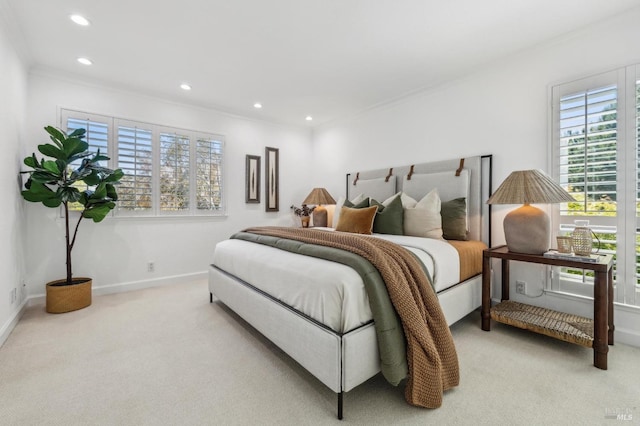 carpeted bedroom with recessed lighting, ornamental molding, and baseboards