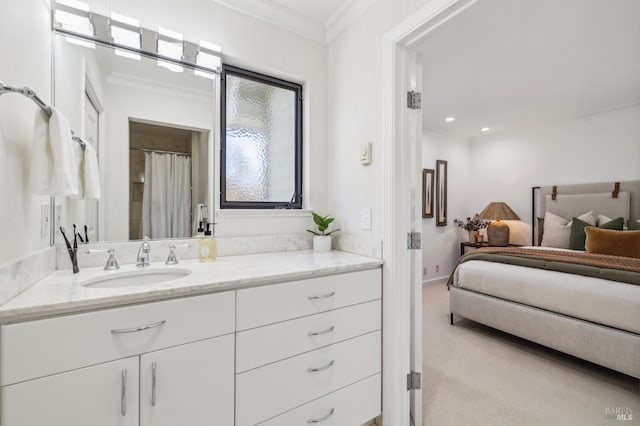 bathroom featuring crown molding and vanity