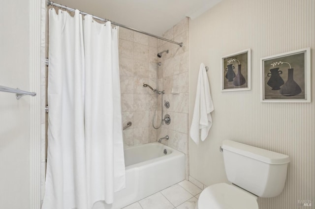 bathroom with toilet, tile patterned floors, and shower / tub combo with curtain