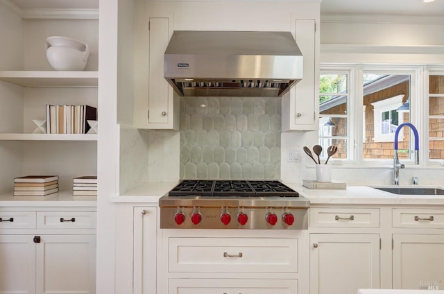 kitchen with white cabinets, open shelves, a sink, ventilation hood, and stainless steel gas stovetop