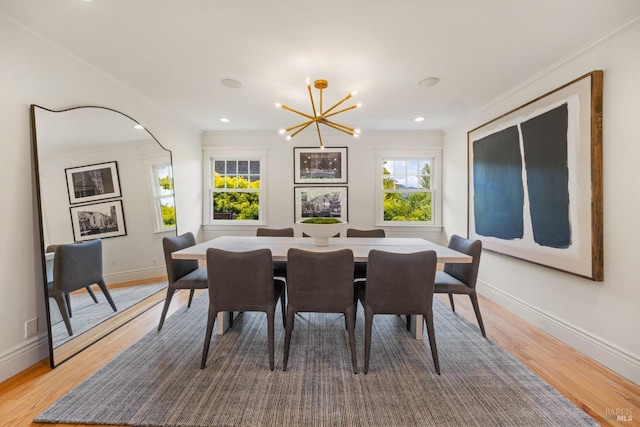 dining room with crown molding, a notable chandelier, light wood-style floors, recessed lighting, and baseboards