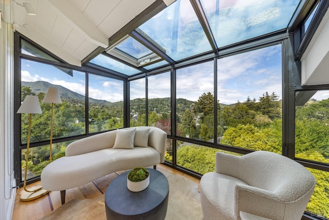 sunroom / solarium featuring a mountain view
