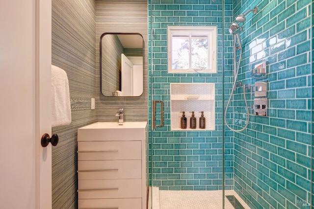 bathroom featuring vanity and a stall shower