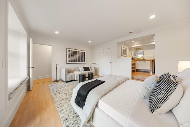 bedroom featuring recessed lighting and light wood-style flooring